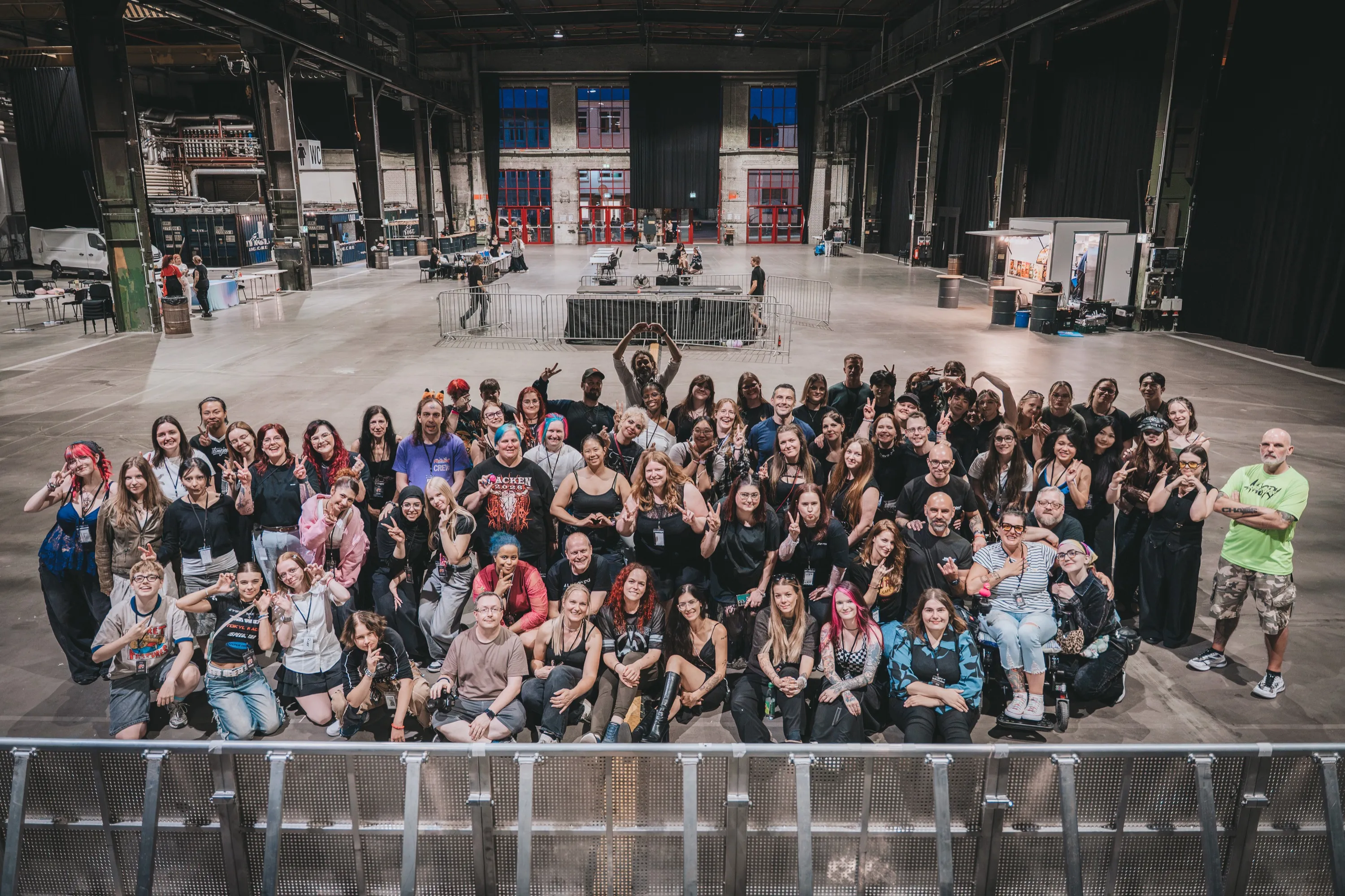 The Proud Nerd crew together in front of the stage at Asian Revolution